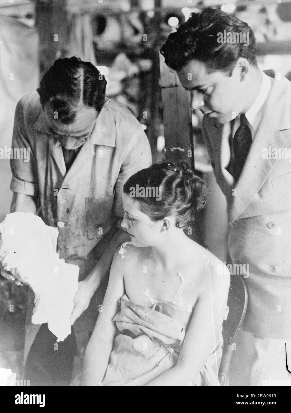 Film star duplicated in wax . FIlm doubling of an unusual type took