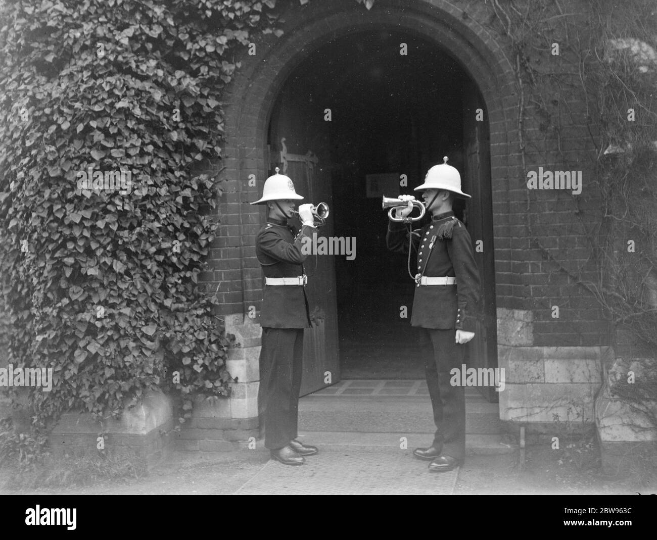 Funeral service for HMS M2 a Royal Navy aircraft-carrying submarine shipwrecked in Lyme Bay, Dorset, Britain, on 26 January 1932 , took place in the Barrack church at Chatham . Relatives of the men who came from Chatham attended . Marines sounding the last post at the door of the church . 5 February 1932 . Stock Photo