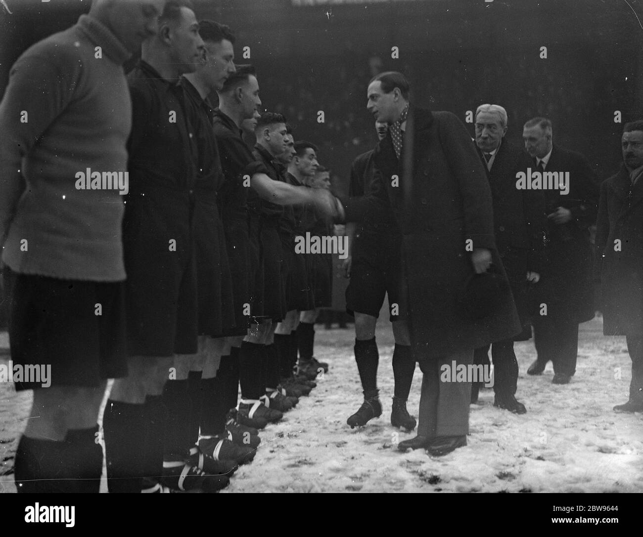 Prince George and the Belgium army team . Prince George shaking hands with the Belgian Army team on the Selhurst Park , London ground , before the start of the football match between the British Army and Belgian Army team . 13 February 1932 Stock Photo