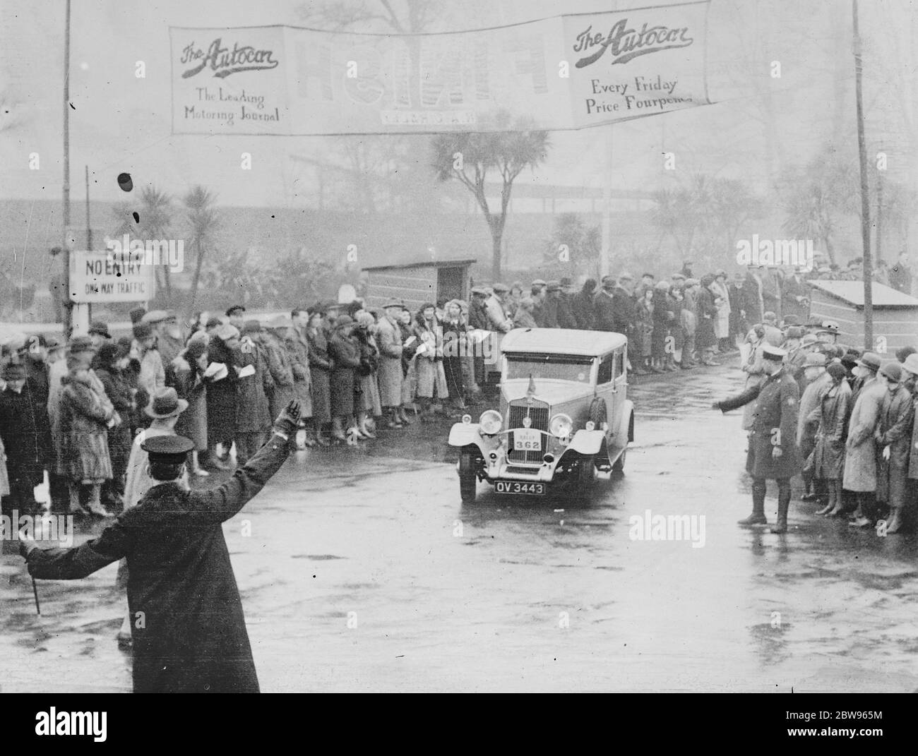 Competitors in great RAC rally arrive at Torquay . Miss E M Robertson ' s  14 . 9 h . p Star car passing the finishing post on arrival at Torquay at
