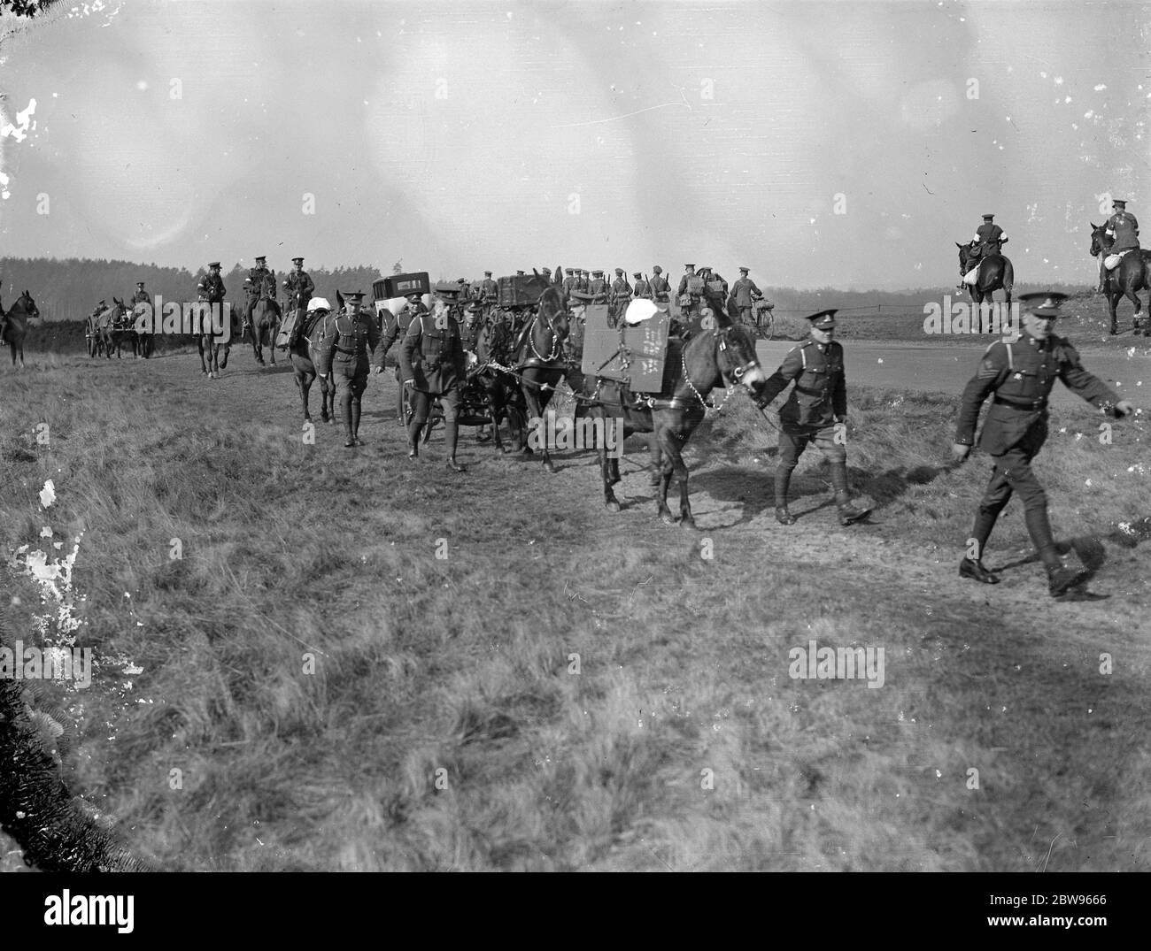 Harrow school cadets hold field day at Aldershot . Harrow school officers training corps had the annual field day , carrying out operations in the Long Valley at Aldershots . Harrow cadets march past pack animals carrying supplys . 1 March 1932 Stock Photo