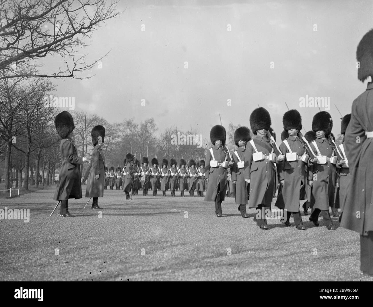 Prince of Wales inspects his regiment on St Davids day at Aldershot . The Prince of Wales inspected the 1st Battalion Welsh Guards , of which he is colonel in Chief at their barracks at Aldershot on St Davids day . The Prince of Wales saluting the regimental Colours as they were carried past him on the parade ground . 1 March 1932 Stock Photo