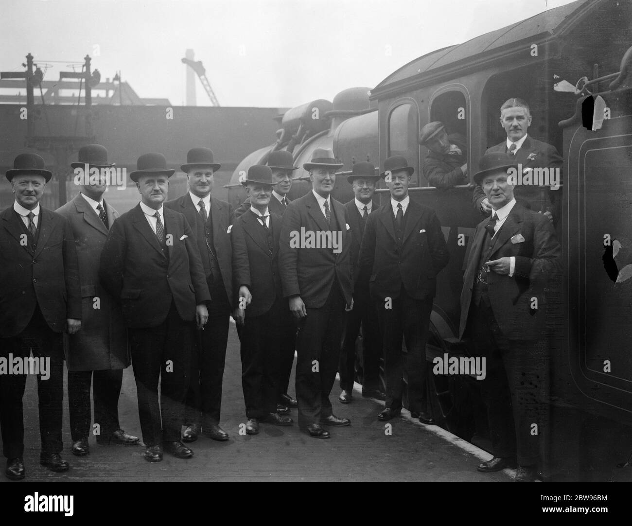 Station masters meeting in London to discuss their problems . Station masters from the London and North Eastern Railway stations all over England met at Liverpool Street station , London , for a conference to discuss their problems and establish personal contact between the stations . Among those present were station masters from Hull , Sunderland , Dundee , Manchester , Newcastle , Edinburgh , York , Glasgow , Marylebone and Kings Cross . Some of the station masters attending the conference chatting to an engine driver at Liverpool Street station , whose master Mr Hubert Calver may be seen ne Stock Photo