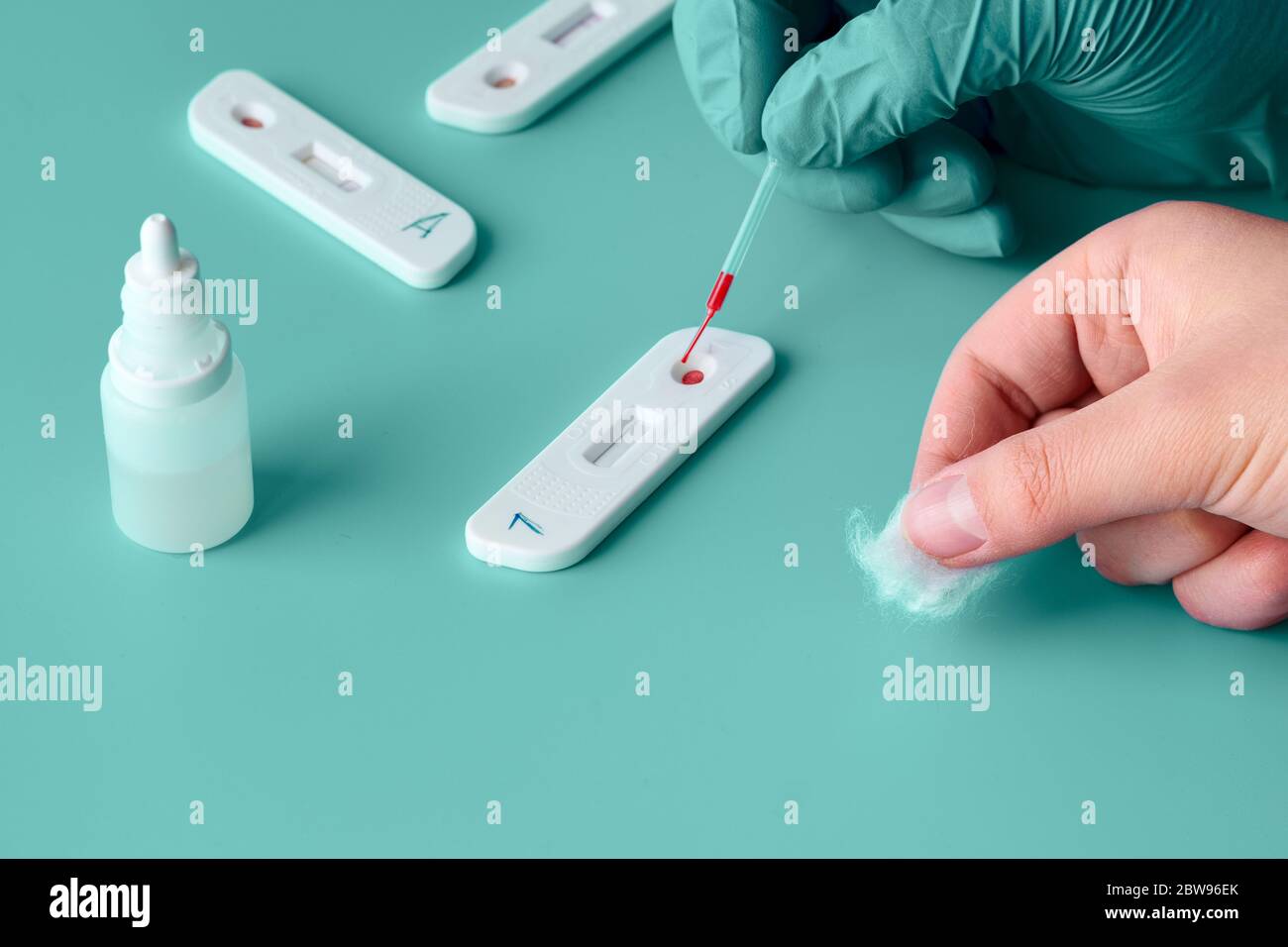 Premium Photo  Express covid-19 test for igm and igg antibodies to novel  coronavirus sars-cov-2, covid-19. nurse hand in glove collects patient  blood with disposable pipette. purple neon background.