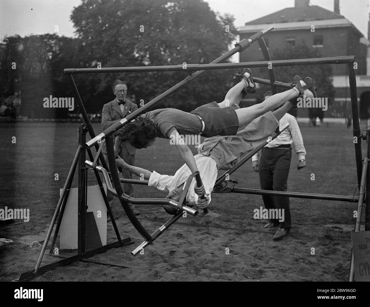 Society ' s latest slimmer seen at Conocours D' elegance at Chelsea . The Gymo Frame , a new slimming and exercising device , was shown at the Summer Fete and Concours d ' Elegance in aid of Disabled soldiers officers garden home at the Duke of Yorks headquarters at Chelsea , London . The new gymnastic frame . 14 July 1932 Stock Photo