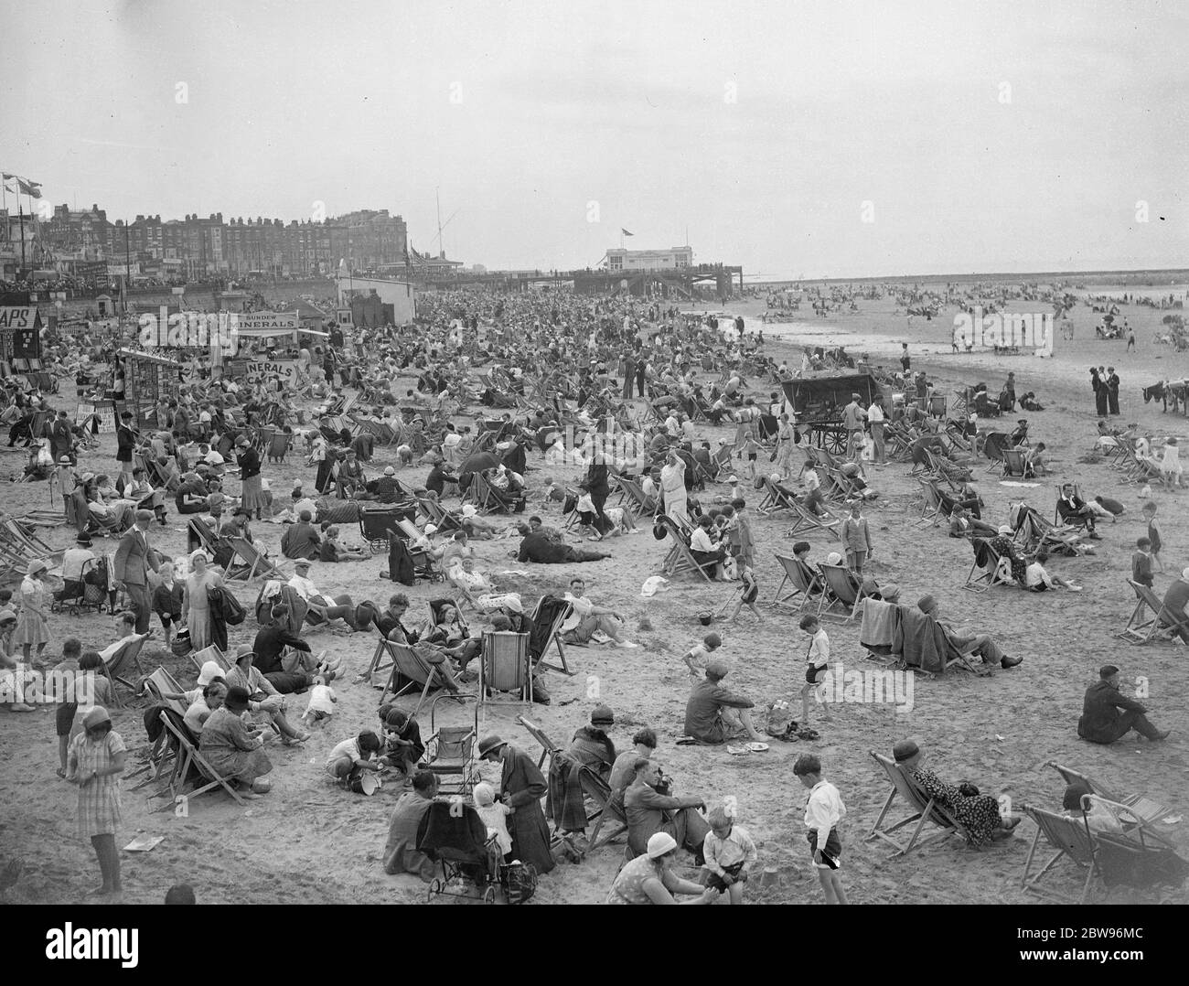 Enprmous crowds at Margate for August holiday . An enormous crowd spent the August holiday on the sands at Margate , Kent . The crowded beach at Margate . 31 July 1932 Stock Photo