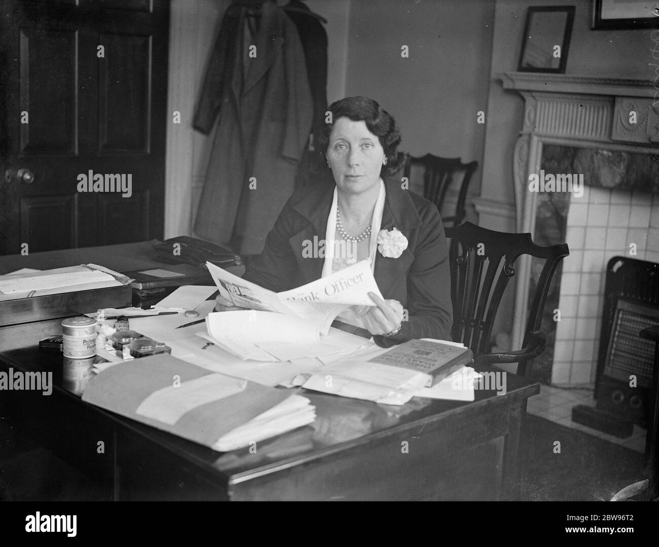 Daughter of late Labour Minister appointed organiser of Bank Officers Guild . Miss E C Macnamara , daughter of the late Dr Macnamara , the former Minister of Labour , has been appointed woman organiser to the Bank Officers Guild . The appointment has become necessary by the large increase of women workers in banks . Miss E C Macnamara , at her desk after her appointment . 4 May 1932 Stock Photo