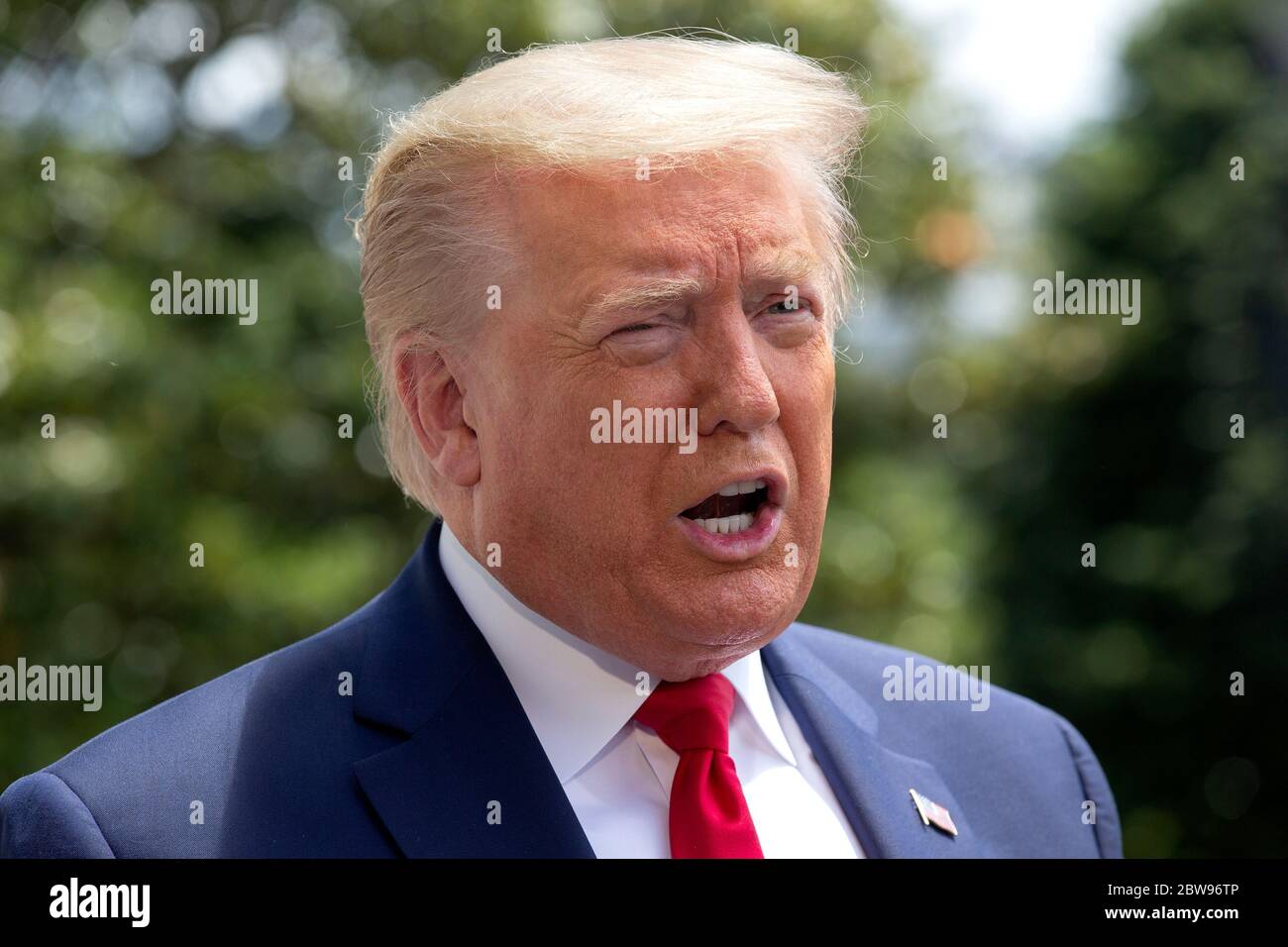 United States President Donald J. Trump speaks to members of the media as he departs the White House in Washington, DC, U.S., on Saturday, May 30, 2020. Trump has used Twitter to criticize protests prompted by the death of George Floyd, as well as the response of Democratic leaders, after demonstrators clashed with Secret Service agents outside the White House last night.Credit: Stefani Reynolds/Pool via CNP /MediaPunch Stock Photo