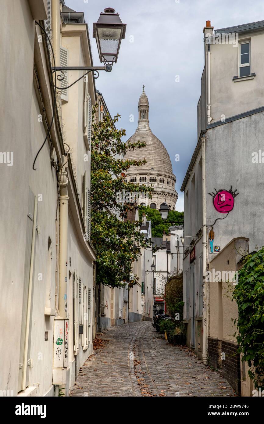 Paris, France - May 12, 2020: Typical street in Montmartre in Paris at the end of the day during lockdown due to covid-19 Stock Photo