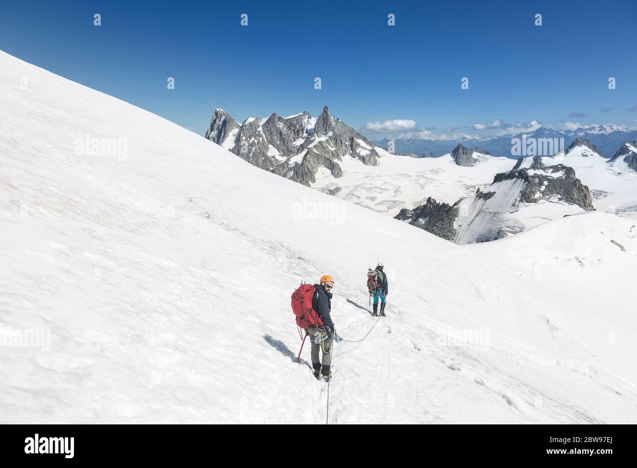 Alpinists with rope and climbing tools on Col du Midi in front of Grandes Jorasses, Mont Blanc massif in the French Alps, Chamonix Mont-Blanc, France Stock Photo