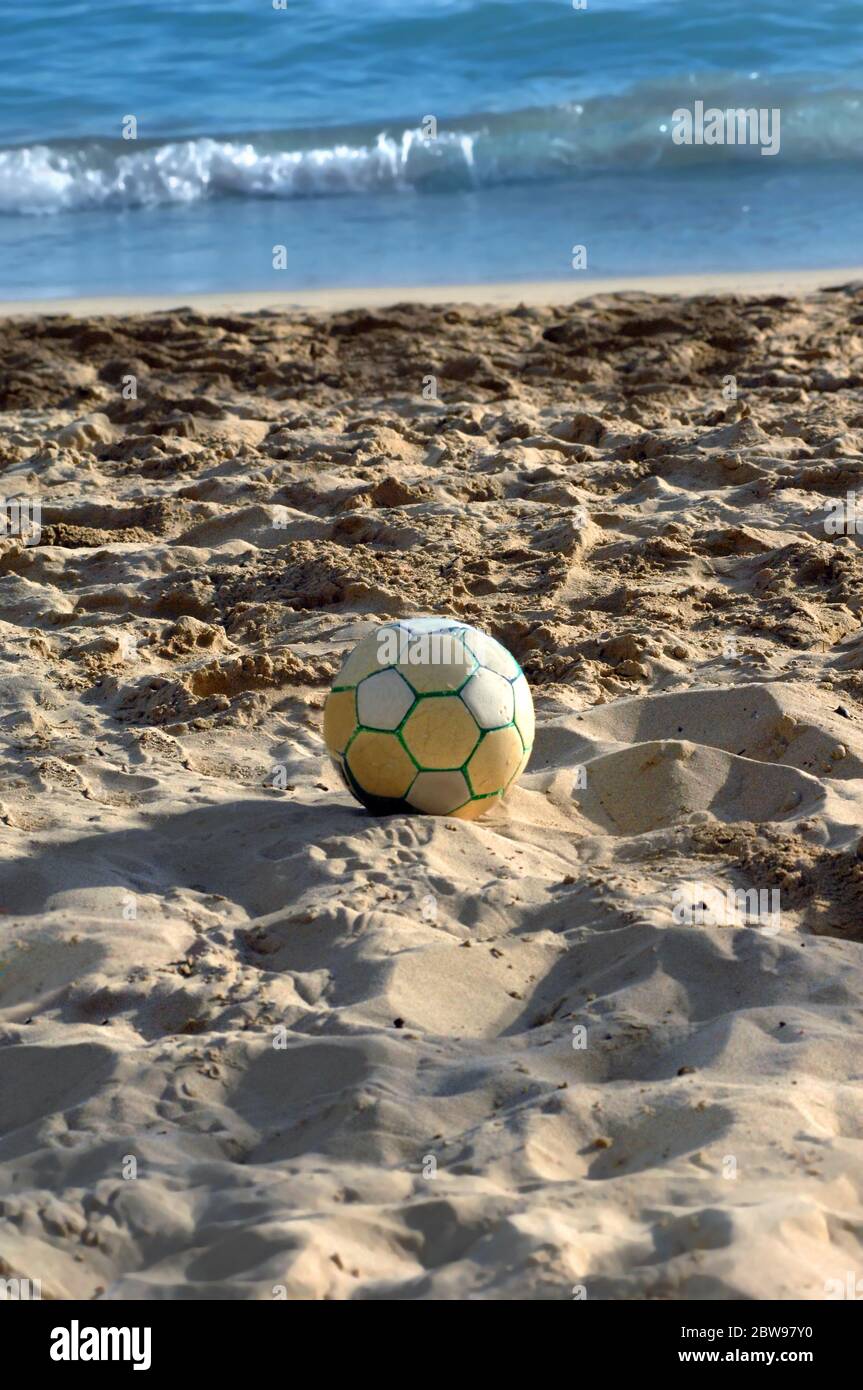 Volleyball lays on the deep sand of Waikiki Beach on the Island of Oahu