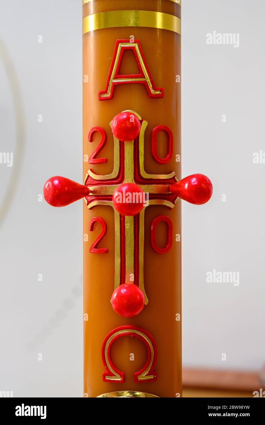 A 2020 Paschal candle (used throughout the Paschal season) in a Catholic church in Bratislava, Slovakia. Stock Photo