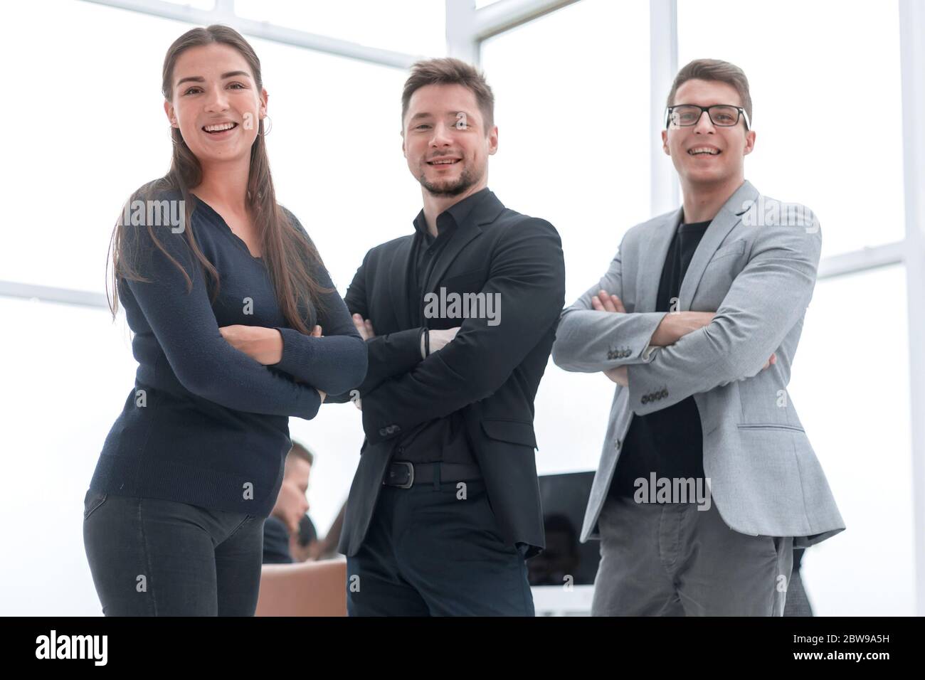 group of happy business people standing in a new office Stock Photo - Alamy