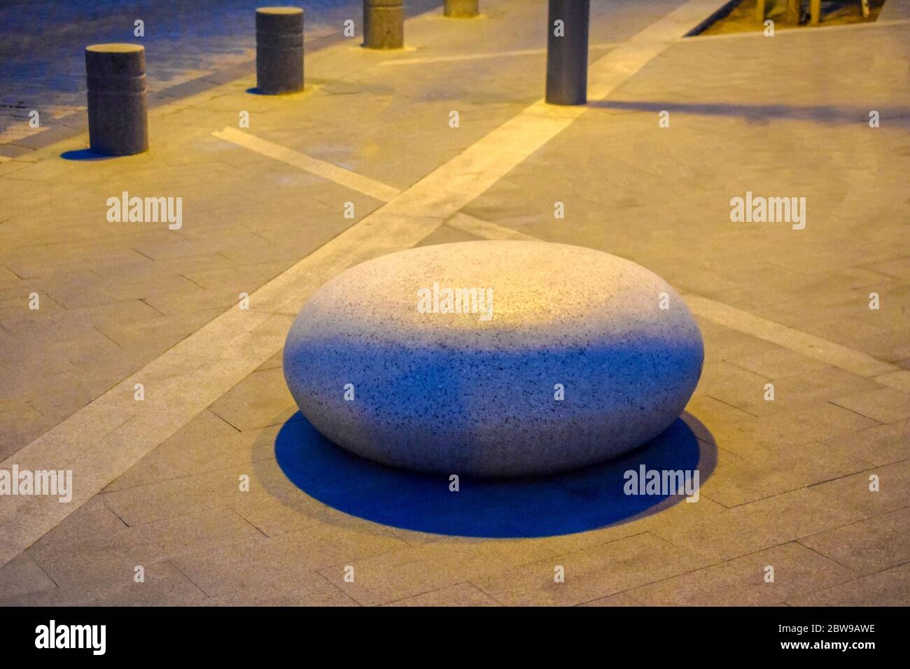 Huge rock on the street in midnight with beautiful street Stock Photo