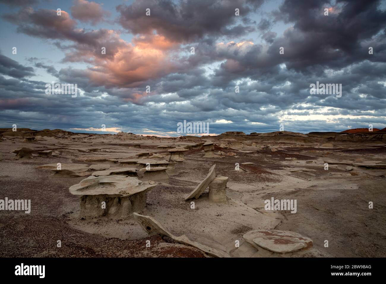 NM00271-00...NEW MEXICO - Cloudy afternoon sunset at the Bisti Wilderness area. Stock Photo