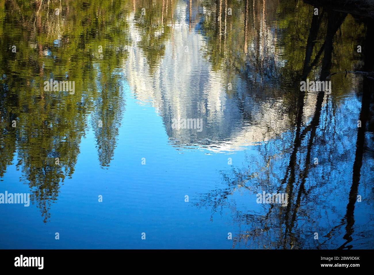 Half Dome Mountain Reflected in Still Water at Yosemite National Park Stock Photo