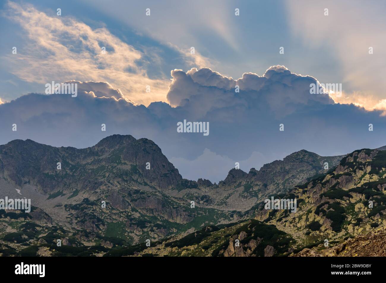 Epic rays of light before sunset in Retezat Mountains, Romania Stock Photo