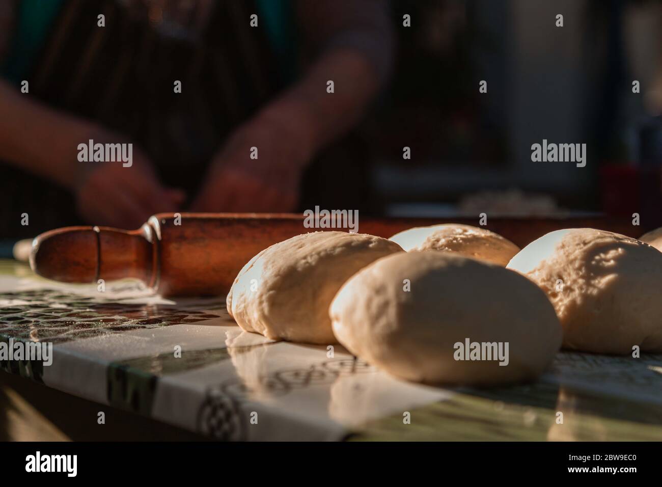 lady kneading on the table Stock Photo