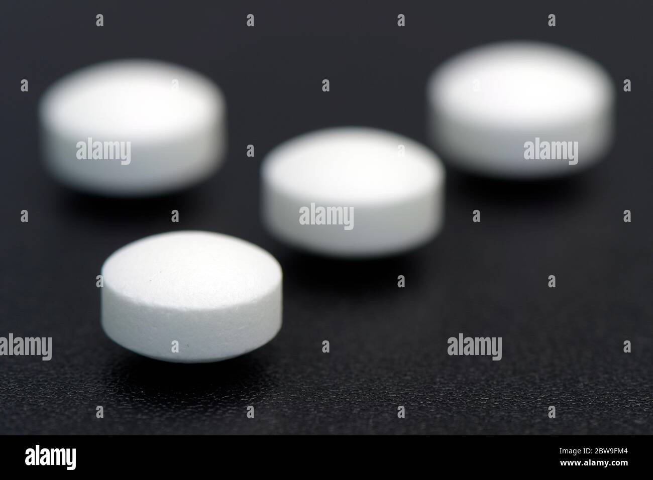 White plain compress tablet on black background in new drug discovery