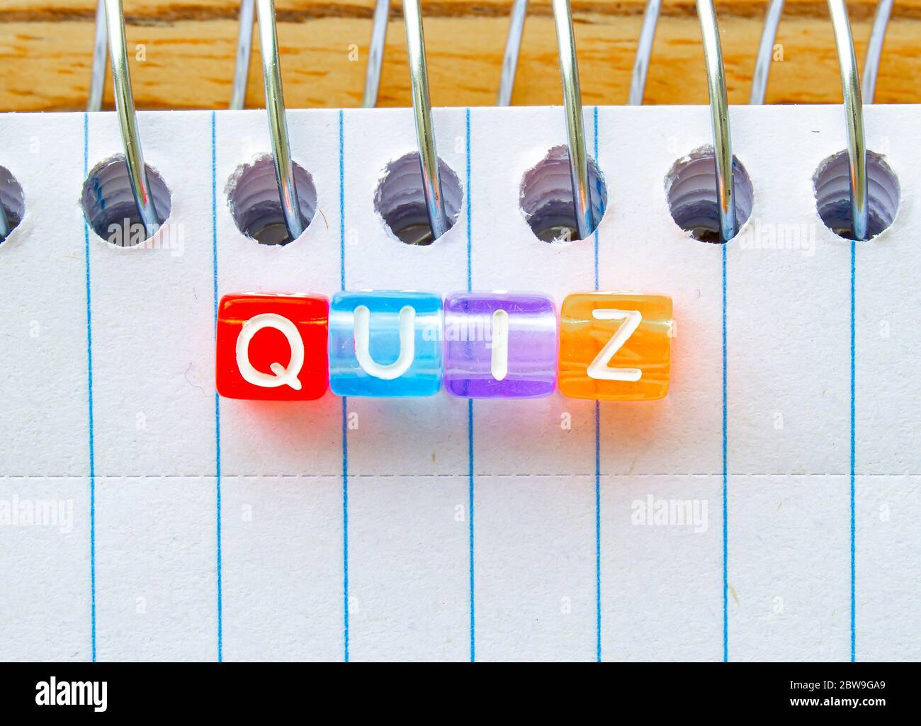 Quiz, message in text on colorful cubes on a notebook Stock Photo