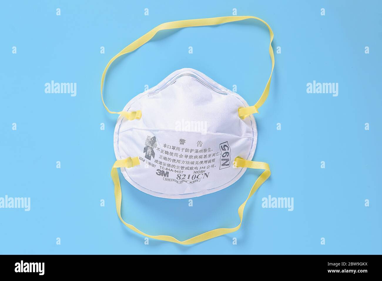 KHON KAEN ,THAILAND,31 MAY 2020 : 3M N95 respirator face mask on blue background N95 a heavy duty protective mask designed to filter out 95 percent of Stock Photo