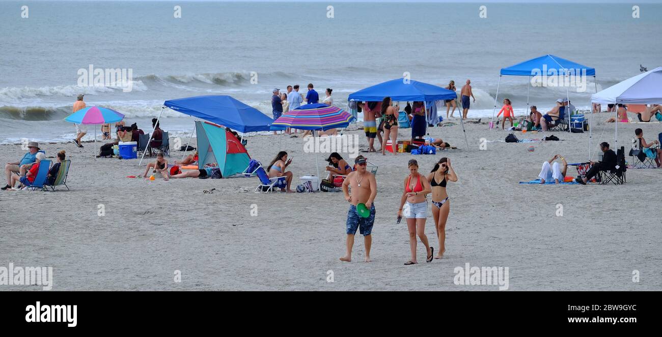 Cocoa Beach, United States. 30th May, 2020. People partake in beach