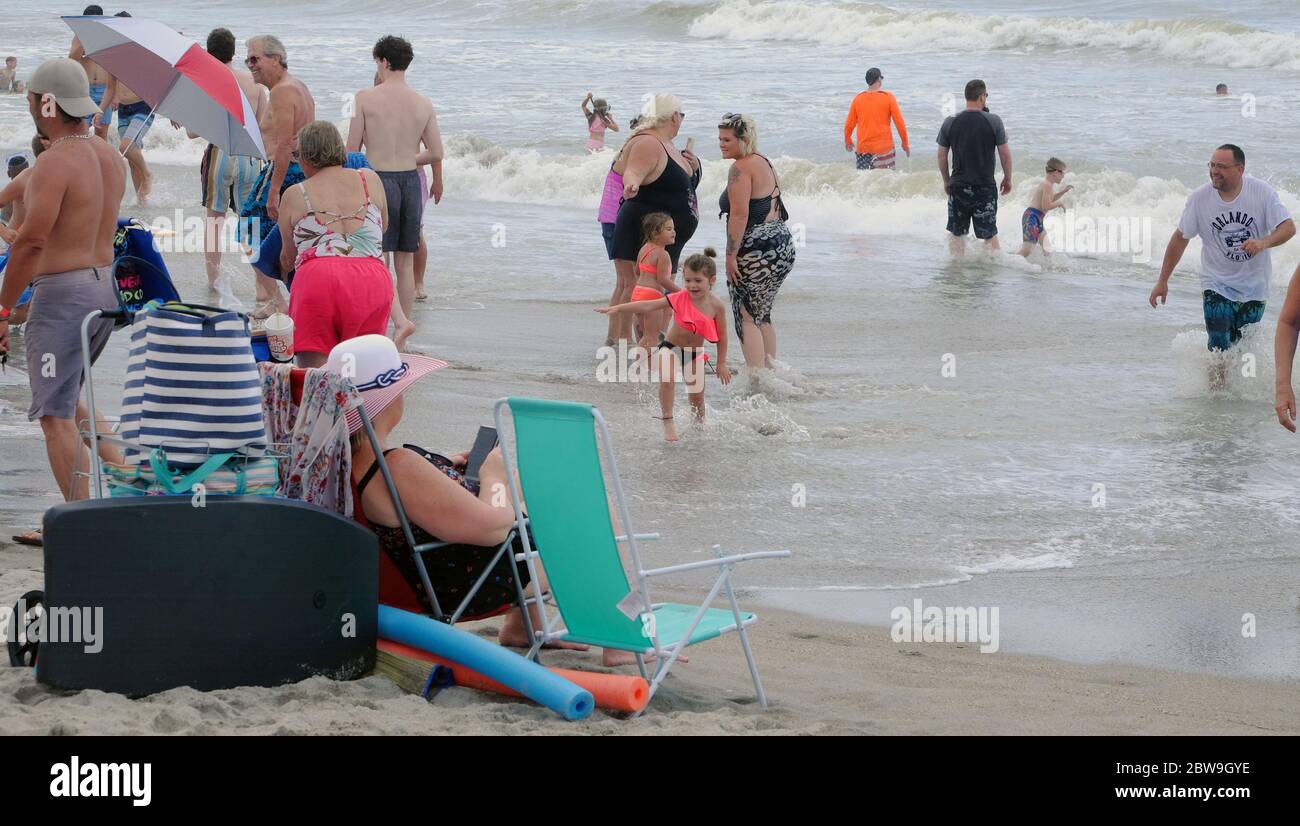 Cocoa Beach, United States. 30th May, 2020. People partake in beach