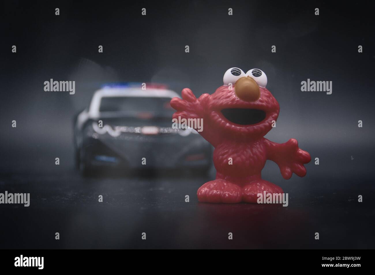 Elmo being stopped by a police car Stock Photo