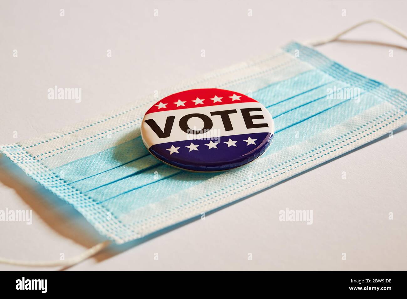 Vote pin on surgical mask Stock Photo