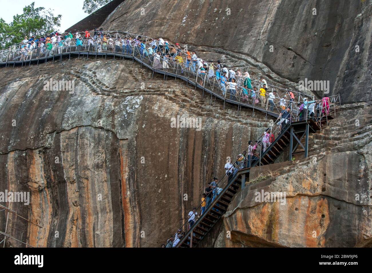Visitors To Sigiriya Rock In Sri Lanka Also Known As The Lion Fortress Climb The Stairs Which Lead To And From The Rocks Summit Stock Photo Alamy