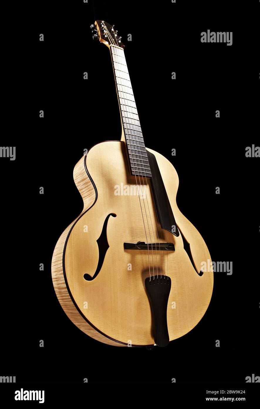 Classical guitar against black Stock Photo
