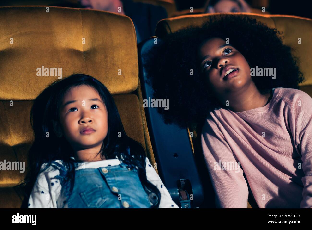 Three Children Having Fun And Enjoy Watching Movie In Cinema Stock Photo Alamy