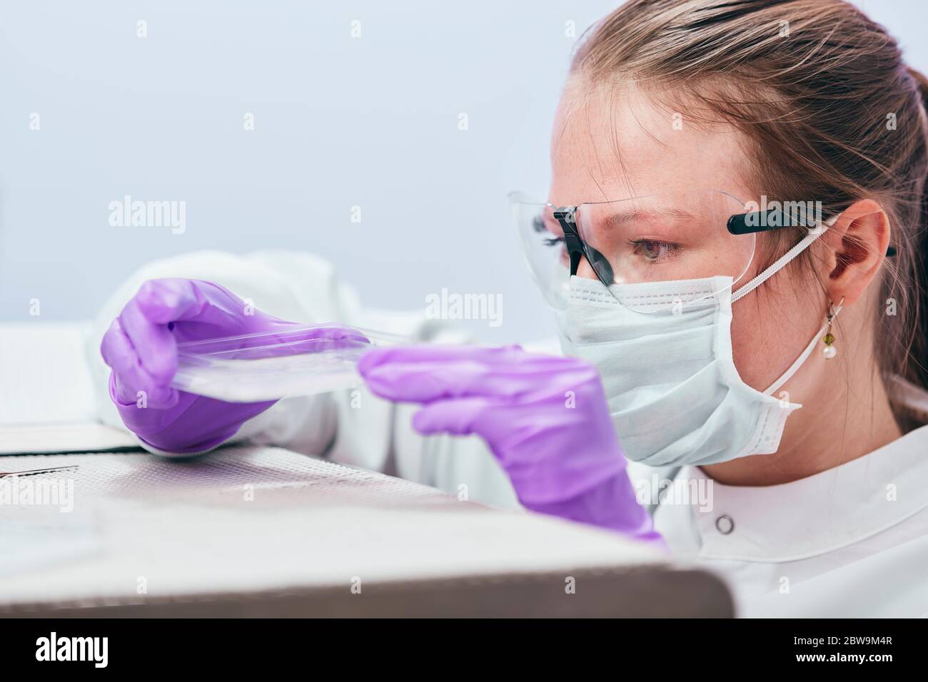 Female technician working in laboratory Stock Photo