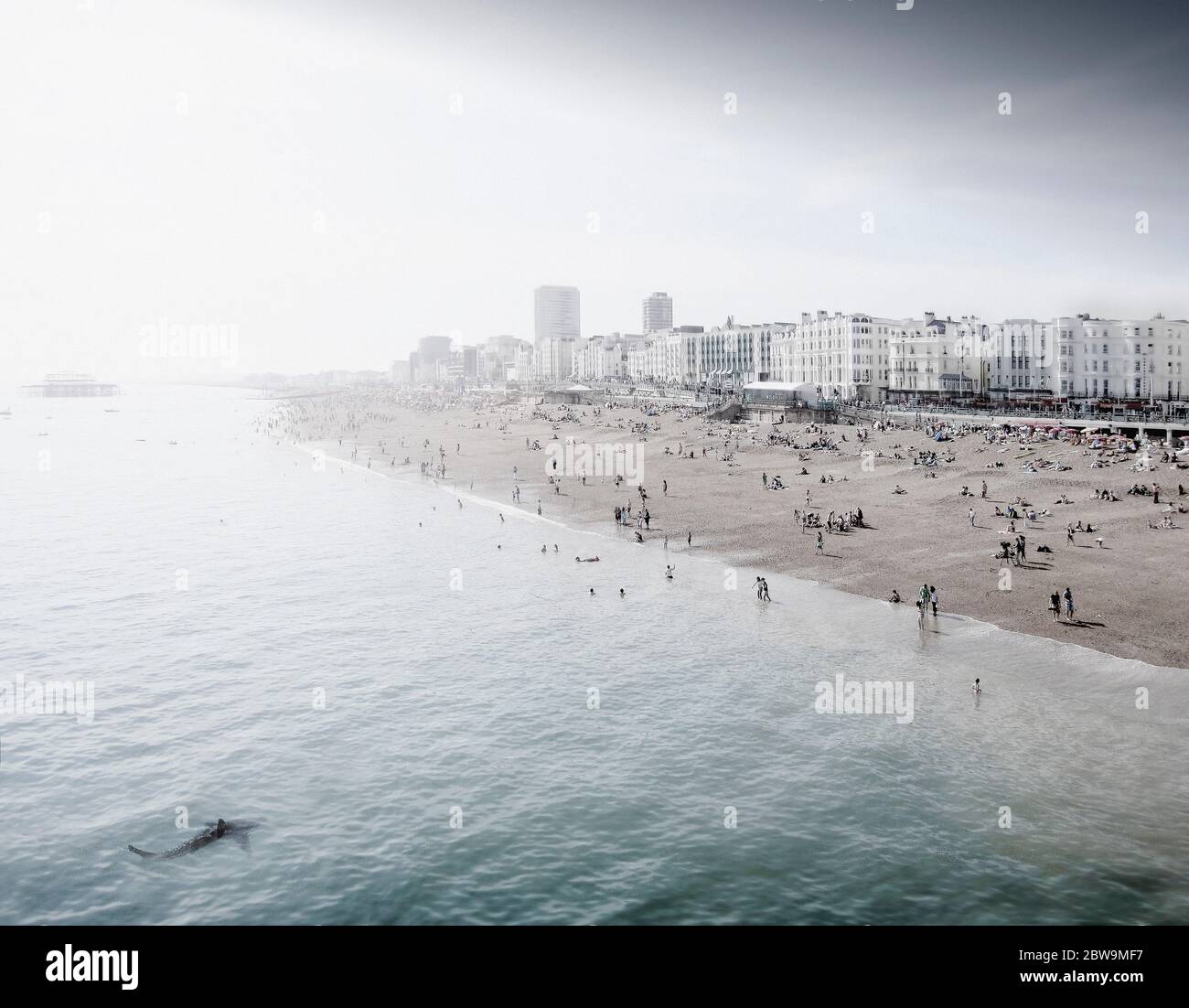 England, Brighton, People resting at urban beach Stock Photo