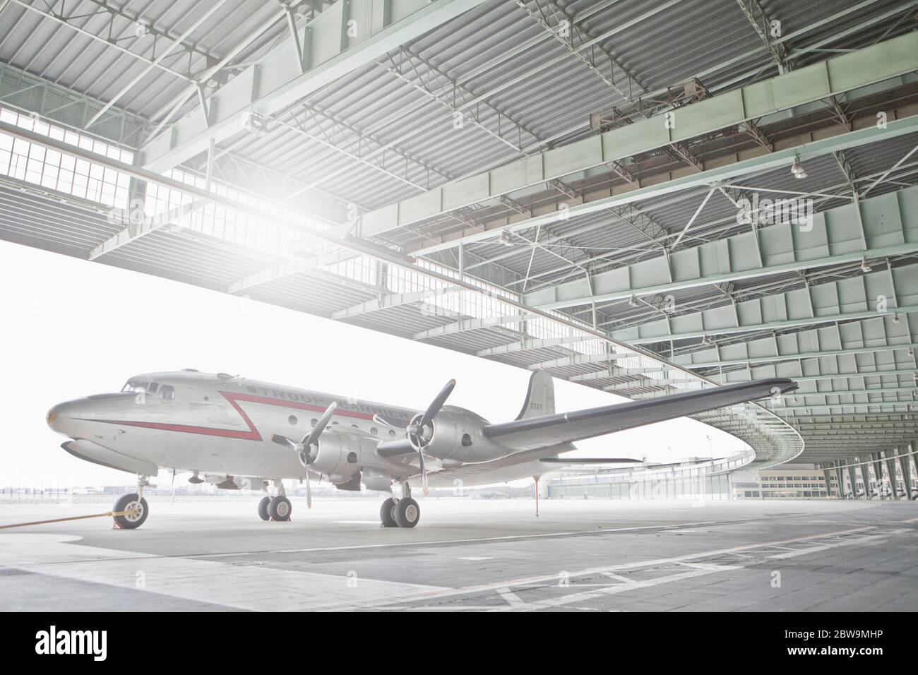 Germany, Berlin, Small airplane in hangar at Tempelhof Airport Stock Photo