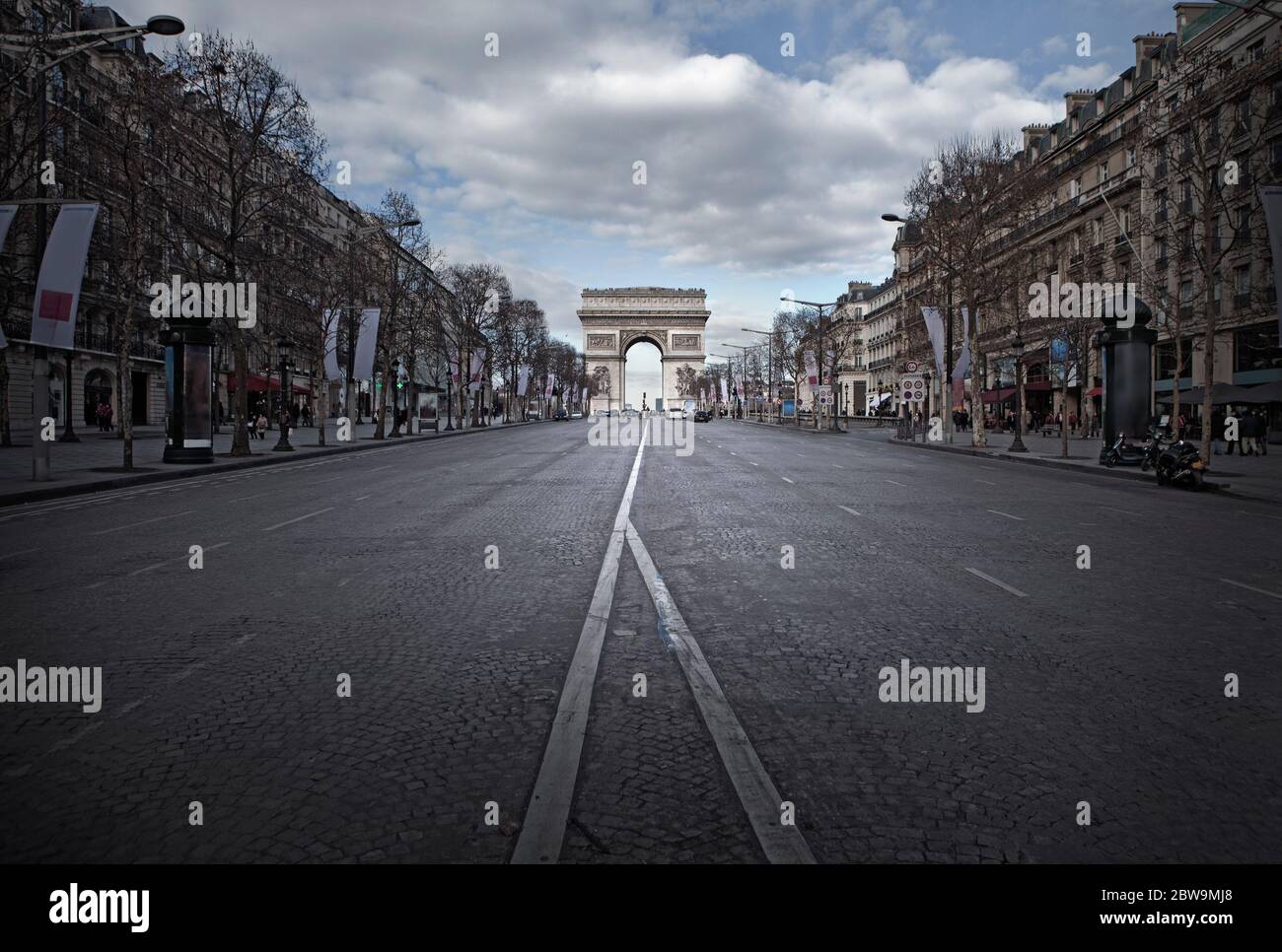 France, Paris, Street with Triumphal Arch at end Stock Photo