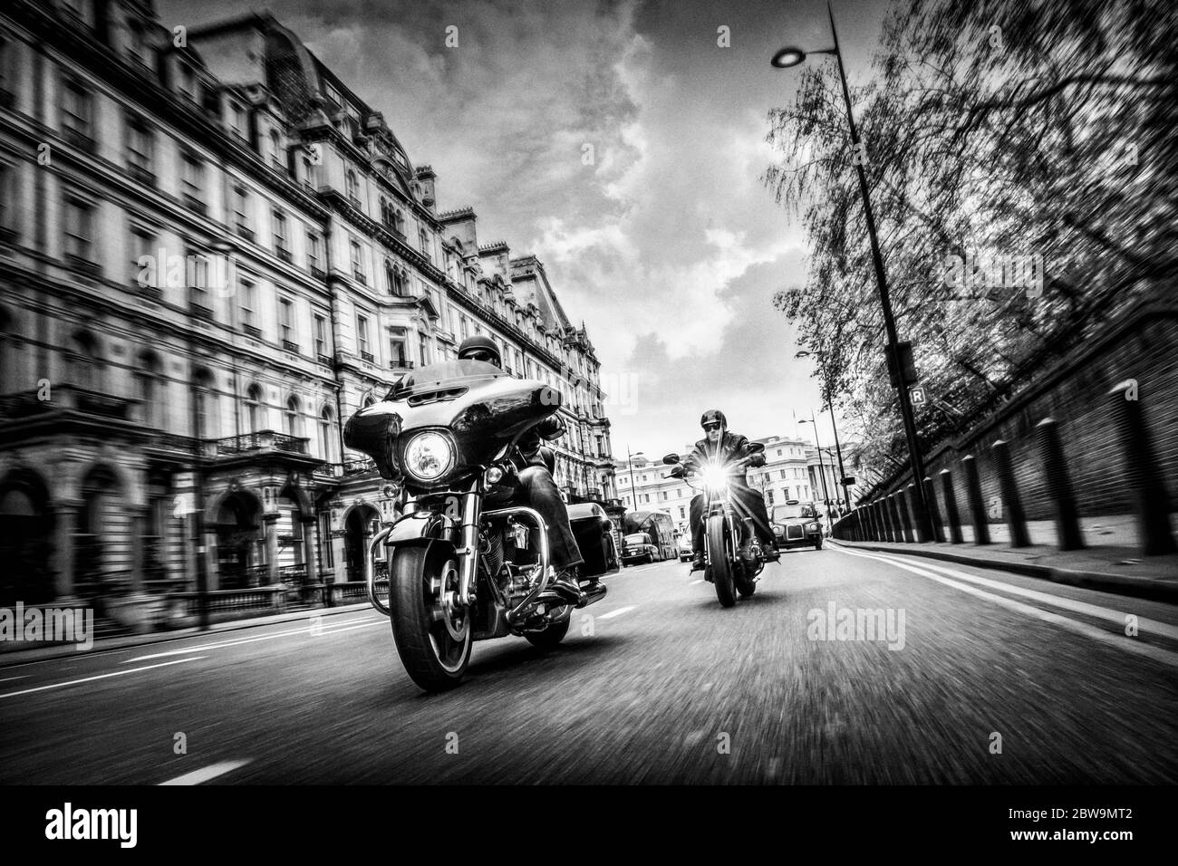 United Kingdom, London, Motorcyclists on city street Stock Photo