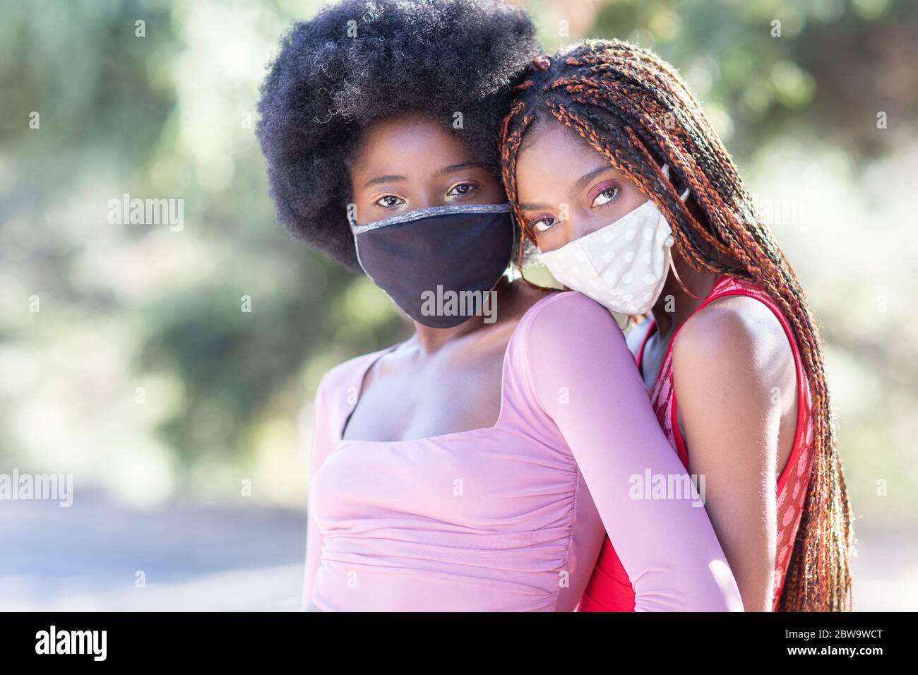 https://c8.alamy.com/comp/2BW9WCT/beautiful-black-girls-outside-wearing-cloth-face-masks-masks-are-mandatory-in-many-places-to-protect-spread-of-coronavirus-2BW9WCT.jpg