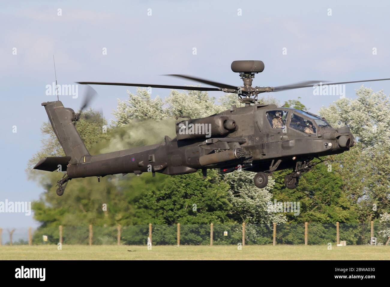 Army Air Corps Apache AH1 attack helicopter landing at Wattisham airfield in Suffolk. Stock Photo