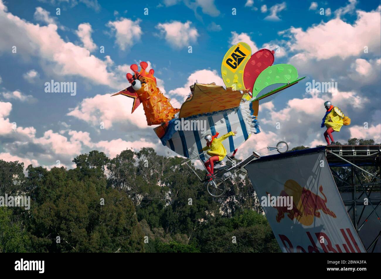 Participants in spoof chicken costumes trying to fly with their handmade flying  machine at the Red Bull Flugtag Tel Aviv Israel an event organized by Red  Bull in which competitors attempt to
