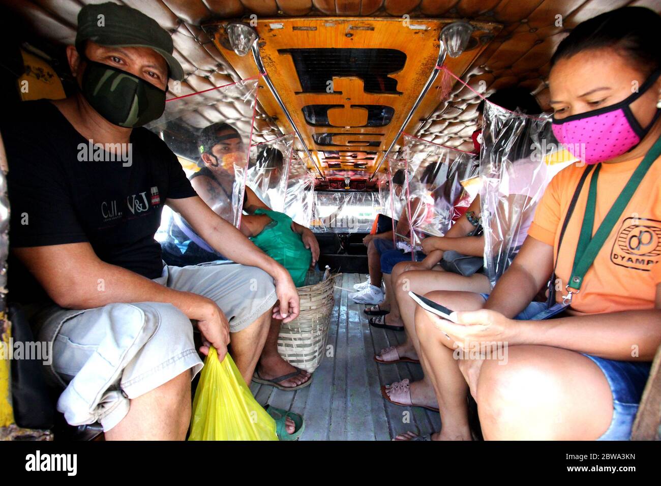 Philippines. 31 May 2020. Passengers taking a dyipneey ride as public transportation to proceed to their destination's along Marcos Highway in Brgy. Mayamot, Antipolo City on May 31, 2020. More dyipneey passenger in Rizal are designed with plastic divider to create a protection to their passengers and they limit the passenger up to 12 passengers. They are travelling only on restricted area and not allowed to cross border of each city and towns but it is highly prohibited by Inter-Agency Task Force on Emergency Infectious Diseases (IATF) to stop this activities. Credit: Pacific Press Agency/Ala Stock Photo