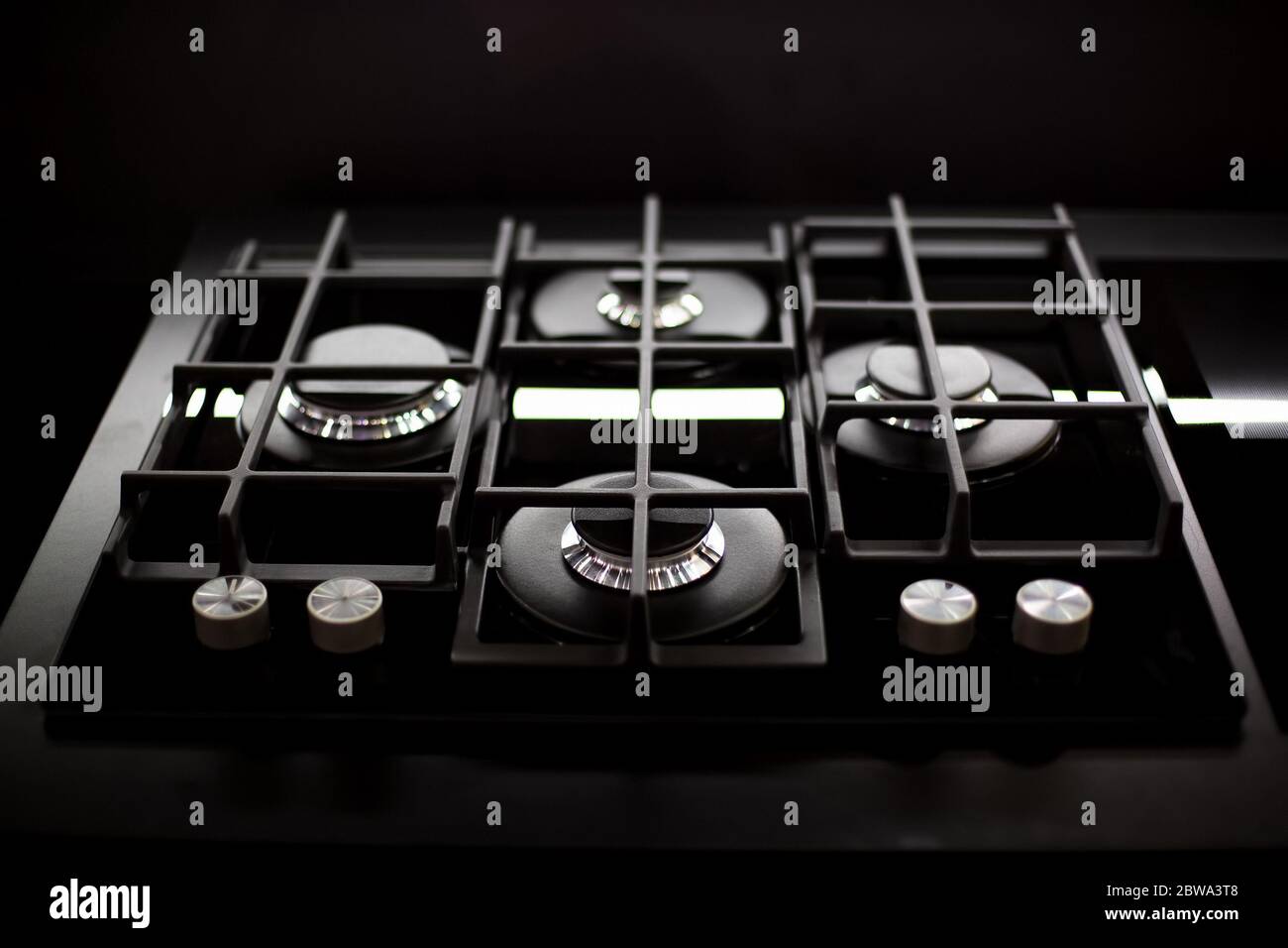 New modern gas stove with four burners for the kitchen, stainless steel