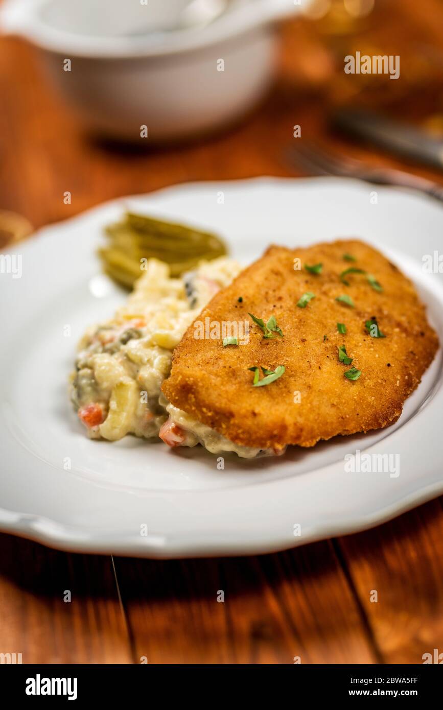 Czech chicken schnitzel or steak with potato salad. Czech traditional ...