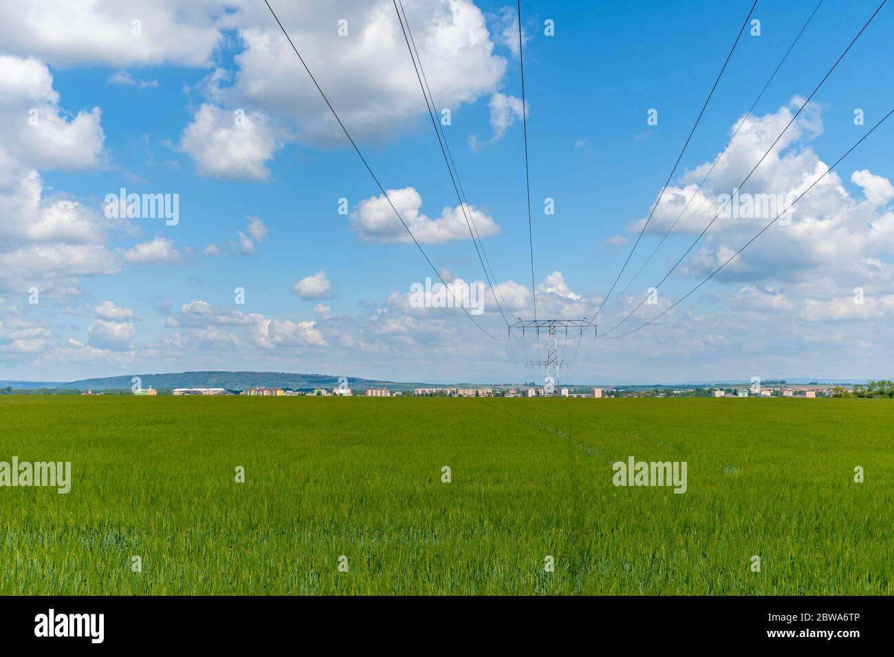 poles with high voltage wires in the country Stock Photo - Alamy