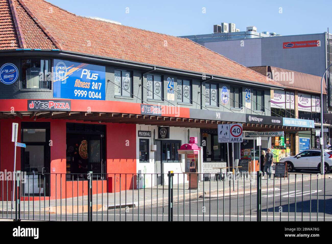 Plus fitness 24 hour gym gymnasium above a pizza restaurant in Mona Vale Sydney,Australia Stock Photo