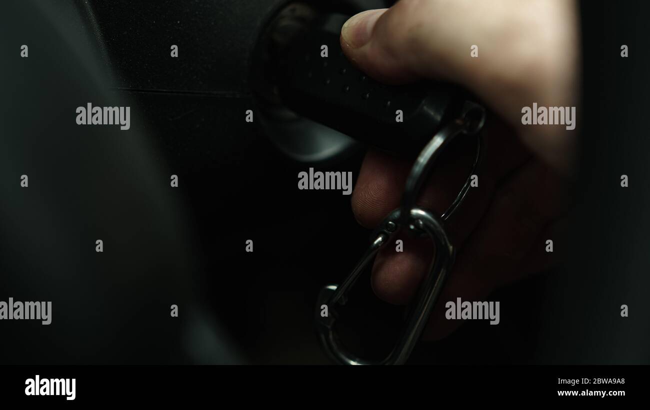 Starting the car by inserting the key into the ignition Stock Photo Alamy
