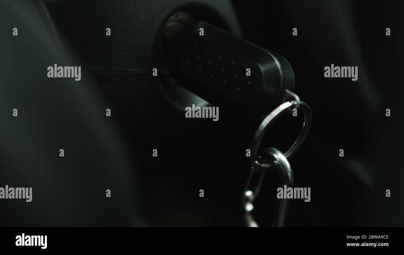 Starting the car by inserting the key into the ignition Stock Photo Alamy