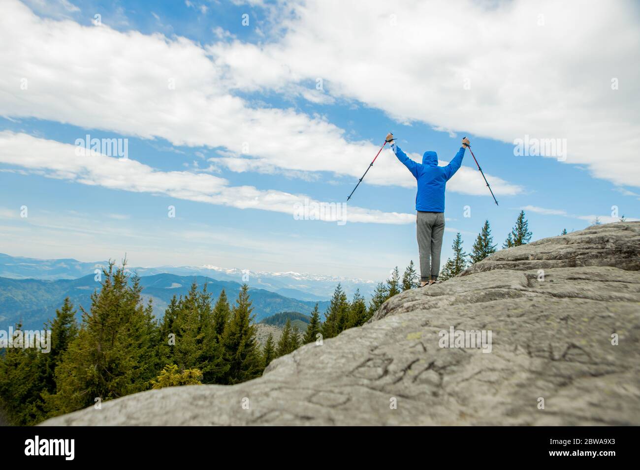 Hiker raising his arms hi-res stock photography and images - Alamy