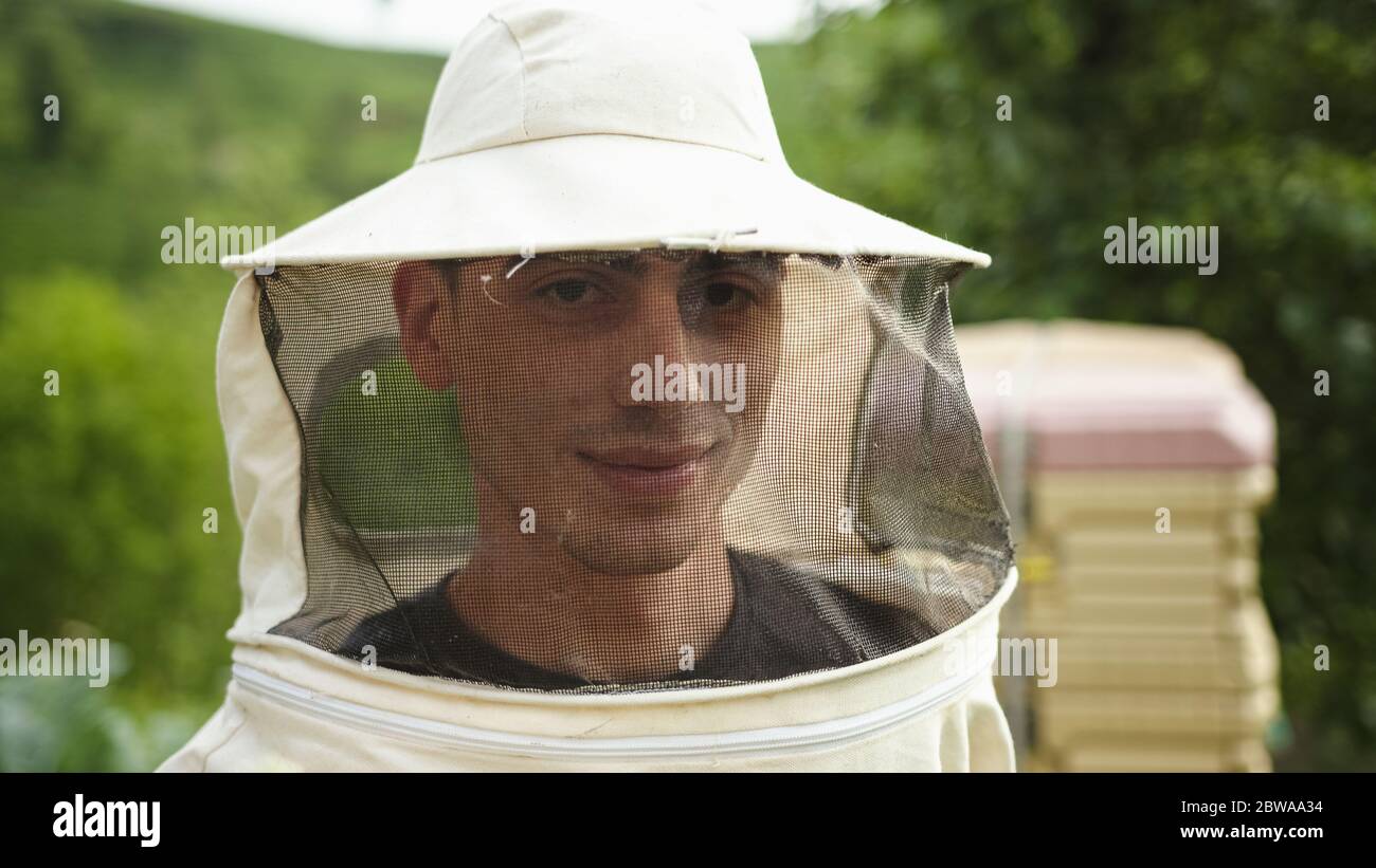 Personnel controlling bee hive The concept of openness Stock Photo