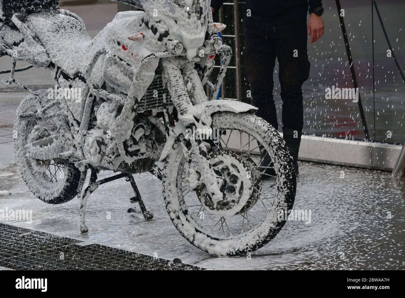 Motorcycle washing with cleaning foam. Pure moto bike. Enduro